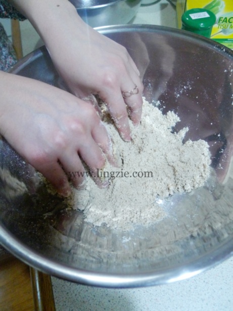 Rubbing in the butter. (And no, those dainty fingers don't belong to me)